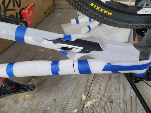 Scratched down tube visible through torn foam